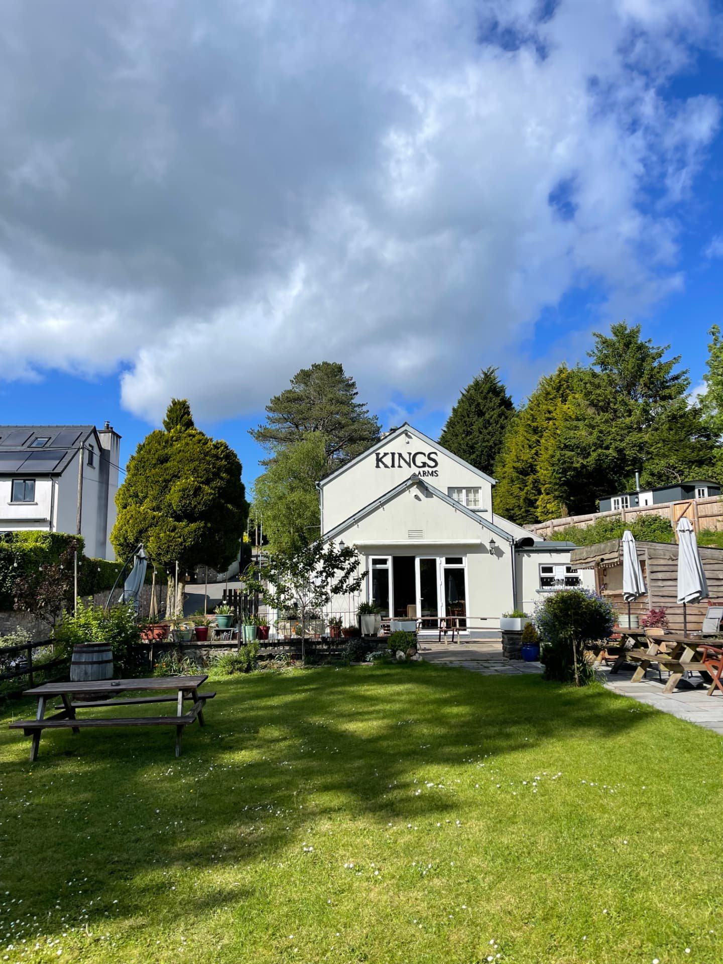 The back of the pub seen across the lawn