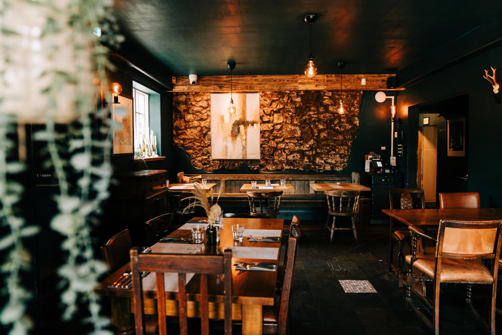 The dining room looking towards the exposed stone wall